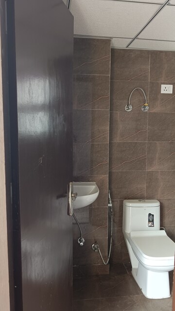 Bathroom in 2 BHK Apartment at Andromida Planet One, Bhopura – for Rent