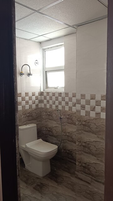 Bathroom in 2 BHK Apartment at Andromida Planet One, Bhopura – for Rent