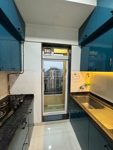 Kitchen in 2 BHK Apartment at Rustomjee Urbania, Thane West – for Rent