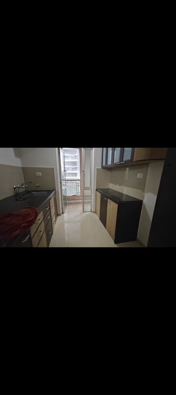 Kitchen in 1 BHK Apartment at Hiranandani Estate Flora, Ghodbunder Road – for Rent
