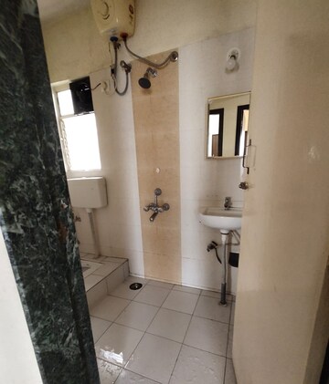 Bathroom in 2 BHK Apartment at Aishwaryam Greens Co-operative Housing Society, Wakad – for Rent