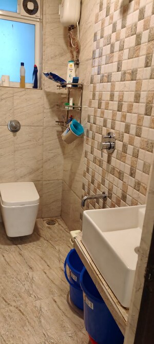 Bathroom in 2 BHK Apartment at Oshiwara Mhada, Andheri West – for Sale