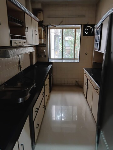 Kitchen in 3 BHK Apartment at Pearl Prabha Apartment, Andheri West – for Rent