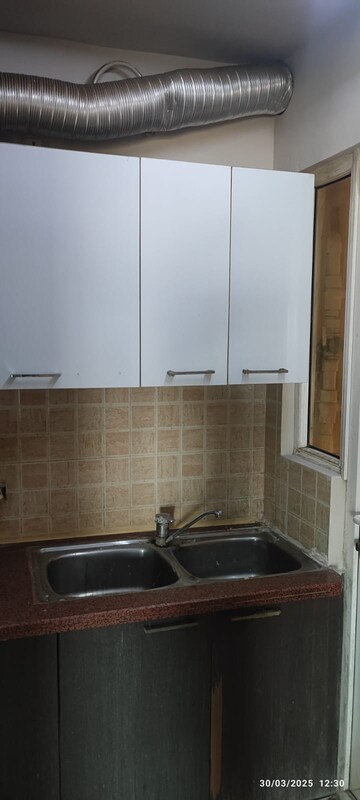Kitchen in 3 BHK Apartment at Antriksh Golf View, Sector 78 – for Rent