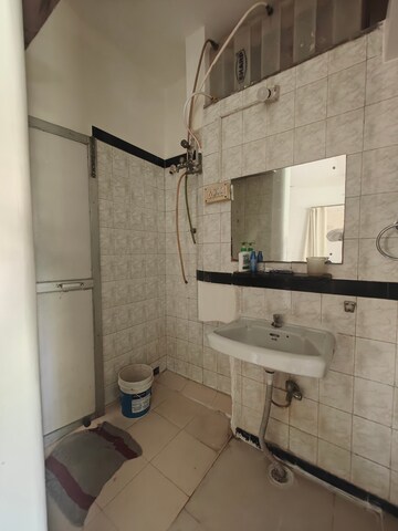 Bathroom in 2 BHK Apartment at Kendriya Vihar Seawoods, Seawoods West – for Rent