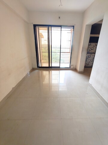 Living Room in 1 BHK Apartment at Om Sai Jai Guruji Tower, Kalyan West – for Rent