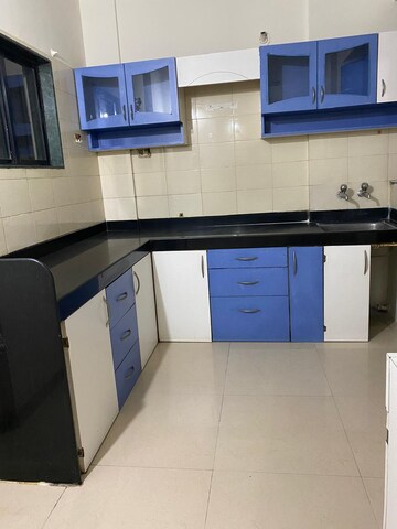 Kitchen in 2 BHK Apartment at Amrut Runwal Daffodils, Nibm – for Sale