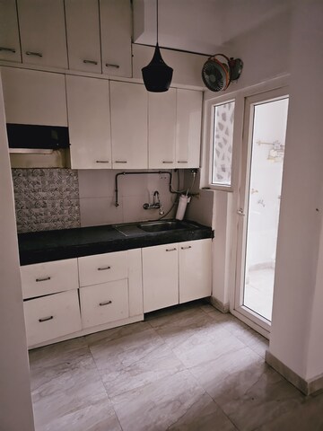 Kitchen in 2 BHK Apartment at Town Park White Orchid, Sector 16c Greater Noida – for Rent