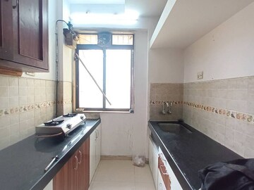 Kitchen in 2 BHK Apartment at Lodha Paradise, Majiwada – for Rent