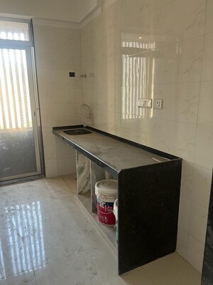 Kitchen in 2 BHK Apartment at Ani Anu Sri Balaji Enclave, Malad West – for Sale