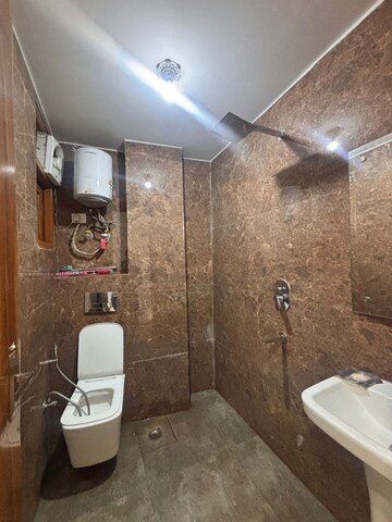 Bathroom in 3 BHK Apartment at Freedom Fighters Enclave – for Rent