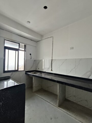 Kitchen in 2 BHK Apartment at Dev Leo Tower, Oshiwara – for Sale