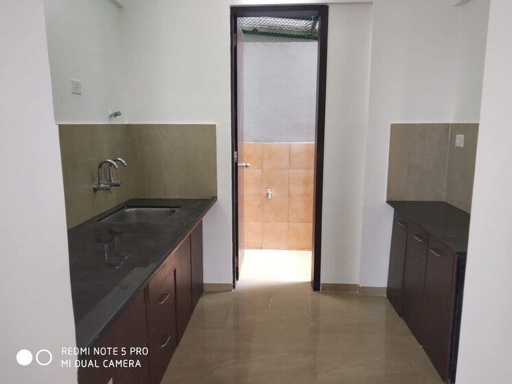 Kitchen, royal-orange-county 2 Bedroom 850 Sq.Ft. Apartment In Rahatani Pune 8940280