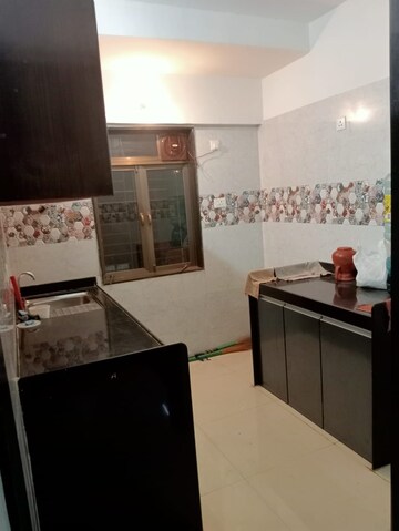 Kitchen in 2 BHK Apartment at Kalpavruksh Garden 1, Kandivali West – for Rent