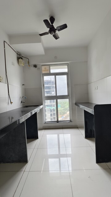 Kitchen in 1.5 BHK Apartment at Godrej Emerald, Ghodbunder Road – for Sale