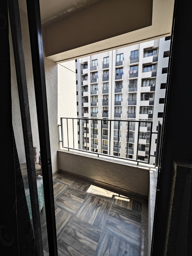 Balcony, sun-atmosphere 2 Bedroom 675 Sq.Ft. Apartment In Shela Ahmedabad 8942732