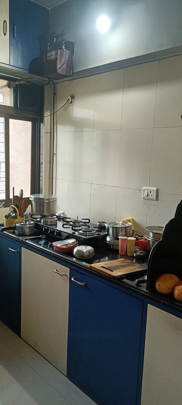 Kitchen in 2 BHK Apartment at Om Sai Plaza, Ghodbunder Road – for Sale