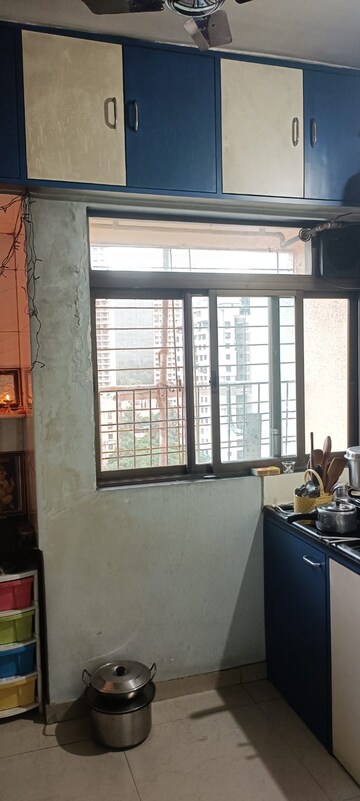 Kitchen in 2 BHK Apartment at Om Sai Plaza, Ghodbunder Road – for Sale