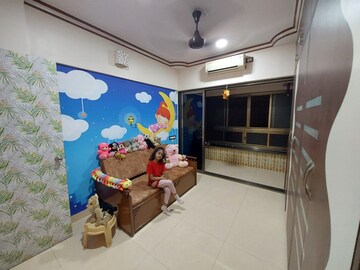Living Room in 2 BHK Apartment at Lokpuram CHS, Vasant Vihar – for Sale