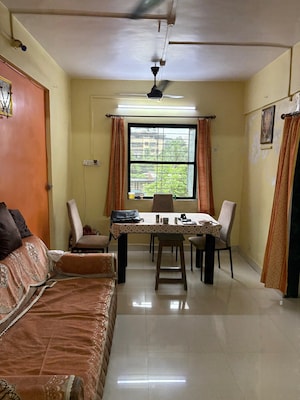 Living Room in 2 BHK Apartment at Ajmera Yogi Dham Phase III, Kalyan West – for Sale