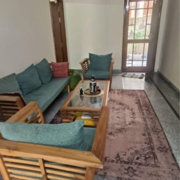 Living Room in 1.5 BHK Builder Floor at Ansal Plaza Sector-23, Carterpuri Village – for Rent