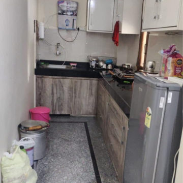 Kitchen in 1.5 BHK Builder Floor at Ansal Plaza Sector-23, Carterpuri Village – for Rent
