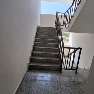 Staircase in 1 RK Apartment at Wave City, Bayana – for Rent