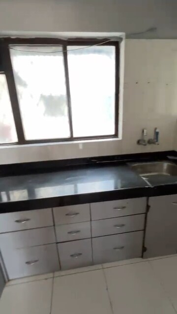 Kitchen in 2 BHK Apartment at Sunshree Woods, Nibm Road – for Rent