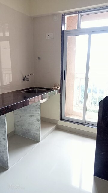 Kitchen in 1 BHK Apartment at Krishna Greenland Park Vastu Federation, Ghodbunder Road – for Rent