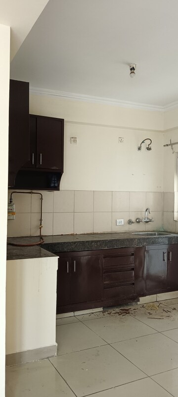Kitchen in 3 BHK Apartment at Amrapali Golf Homes, Sector 4 Greater Noida – for Rent