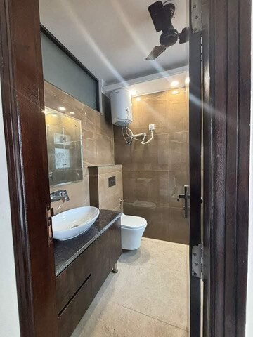 Bathroom in 3 BHK Apartment at Freedom Fighters Enclave – for Rent