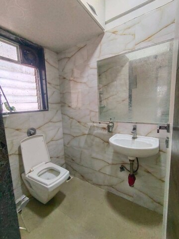 Bathroom in 2 BHK Apartment at Mangesh CHS, Andheri West – for Rent