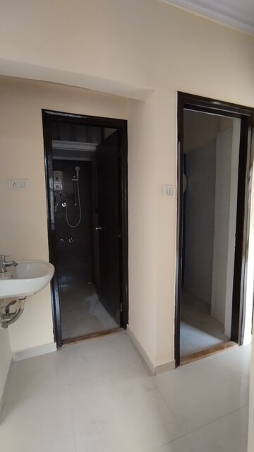 Building Lobby in 1 BHK Apartment at Raunak City Sector 2 B7, Kalyan West – for Rent