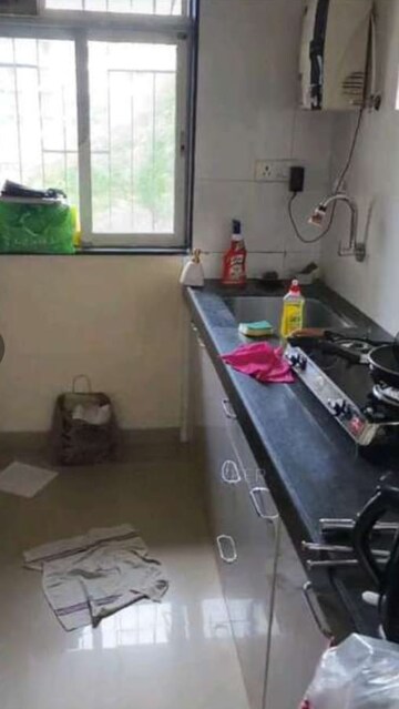 Kitchen in 2 BHK Apartment at Mahalaxmi Towers, Ghodbunder Road – for Rent