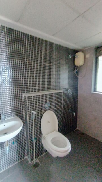 Bathroom in 1.5 BHK Apartment at Lodha Palava Downtown, Dombivli East – for Sale