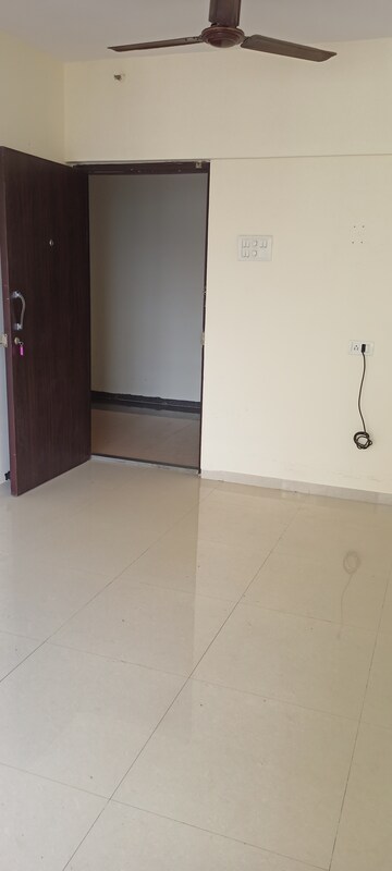 Living Room in 1 BHK Apartment at Rajendra Dolphin Tower, Malad West – for Rent