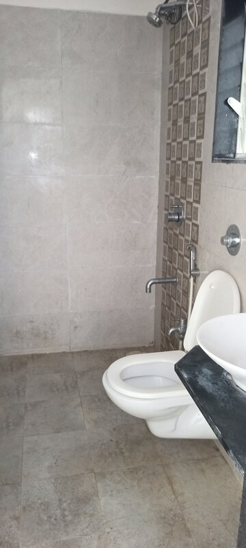 Bathroom in 1 BHK Apartment at Rajendra Dolphin Tower, Malad West – for Rent