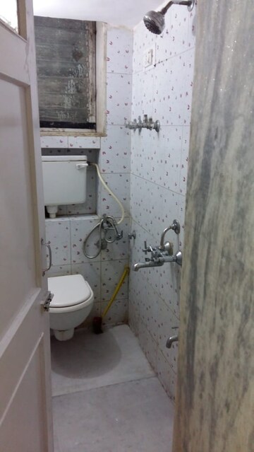 Master Bedroom in 2 BHK Apartment at Pushpraj Building, Goregaon East – for Sale