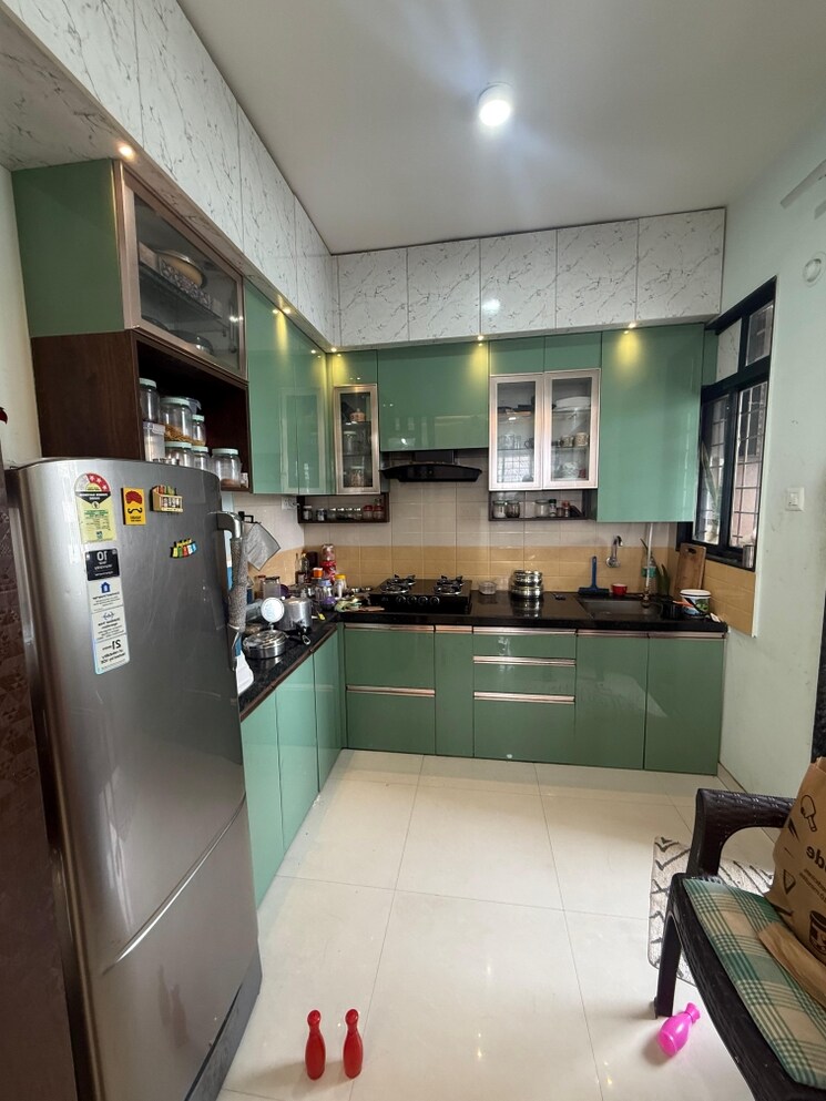 Kitchen, royal-ishana 2 Bedroom 780 Sq.Ft. Apartment In Thergaon Pune 8946915