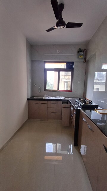 Kitchen in 3 BHK Apartment at Ojass Awantika CHS, Naupada – for Rent