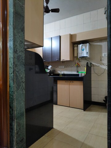 Kitchen in 2.5 BHK Apartment at NRI Complex Phase 2, Seawoods – for Rent