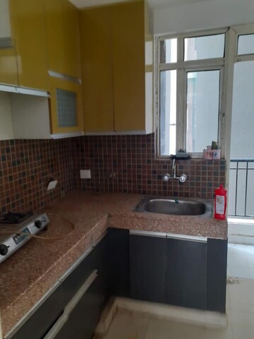 Kitchen in 2 BHK Apartment at Gaur City 2 - 10th Avenue, Sector 16c Greater Noida – for Rent