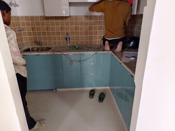 Kitchen in 2 BHK Apartment at Mahagun Mywoods, Sector 16c Greater Noida – for Rent