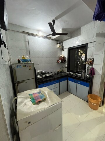 Kitchen in 1 BHK Apartment at Shantinagar CHS, Mira Road – for Sale