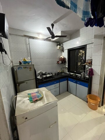 Kitchen in 1 BHK Apartment at Shantinagar CHS, Mira Road – for Sale