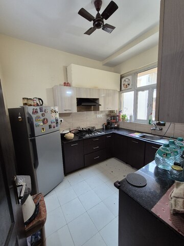 Kitchen in 3 BHK Builder Floor at Ansal API Esencia, Sector 67 – for Rent