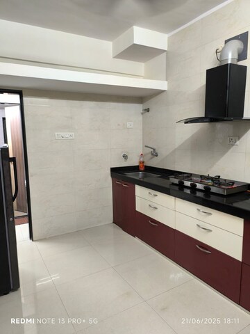 Kitchen in 2 BHK Apartment at Swagat Housing Society, Goregaon East – for Sale