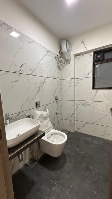 Bathroom in 2 BHK Apartment at JPV Pratap Elegance, Vile Parle West – for Rent