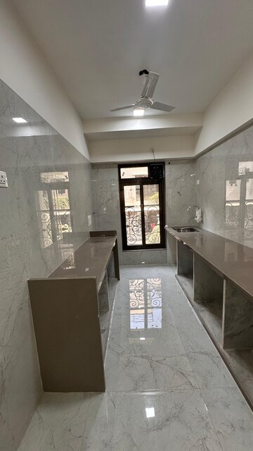 Kitchen in 2 BHK Apartment at JPV Pratap Elegance, Vile Parle West – for Rent