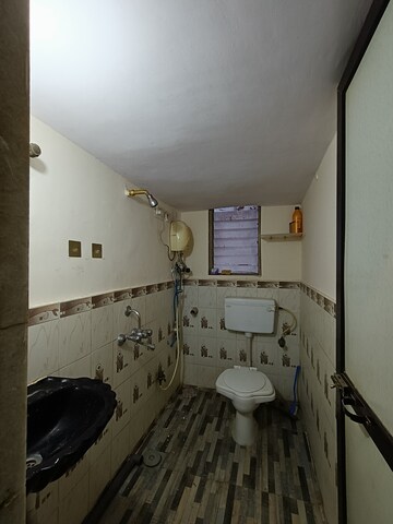 Bathroom in 2 BHK Apartment at Mangal Orchid Chs, Andheri West – for Rent
